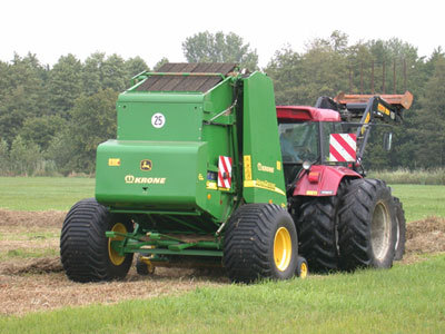 Round baler for use in very wet areas